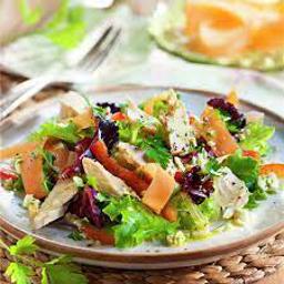 Ensalada de hojas verdes con ventresca de atún, cebolla de figueras i reducción de magrana