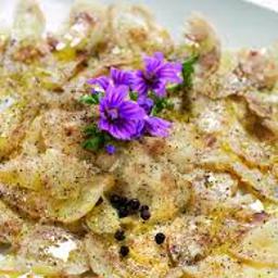 Carpaccio de manitas de cerdo deshuesadas con vinagreta de cítricos